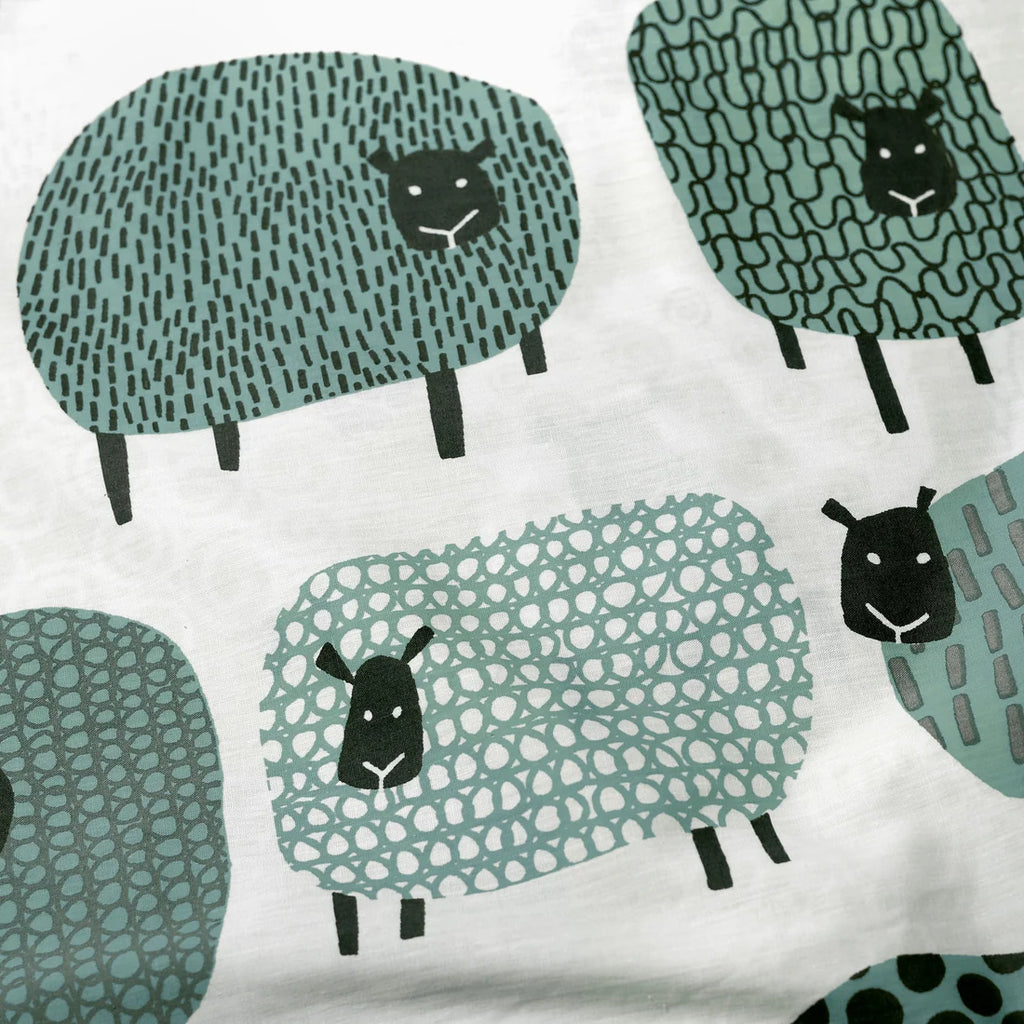 Close-up of the soft cotton-rich polycotton fabric on the Fusion Dotty Sheep duvet cover set.