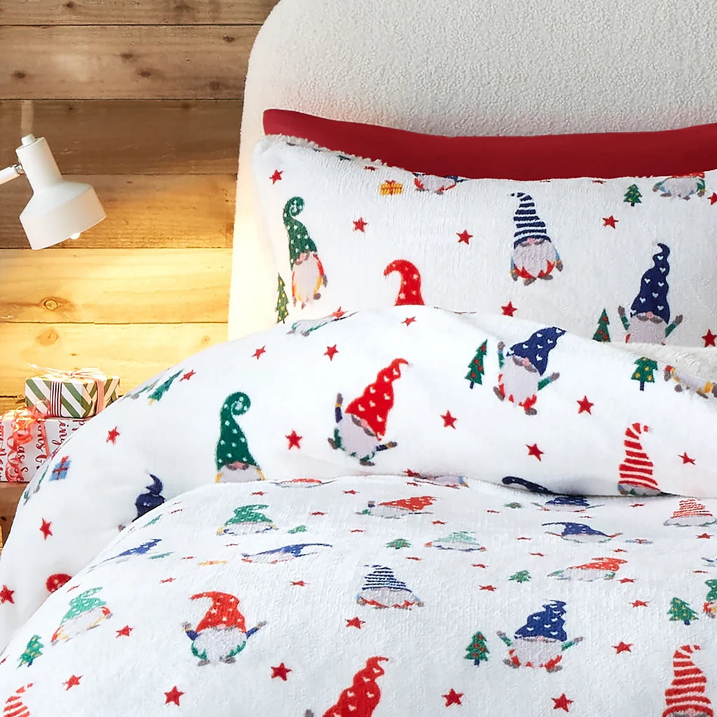 Close-up of the festive gonk, Christmas tree and present design on the Fusion Festive Gonks duvet cover set.