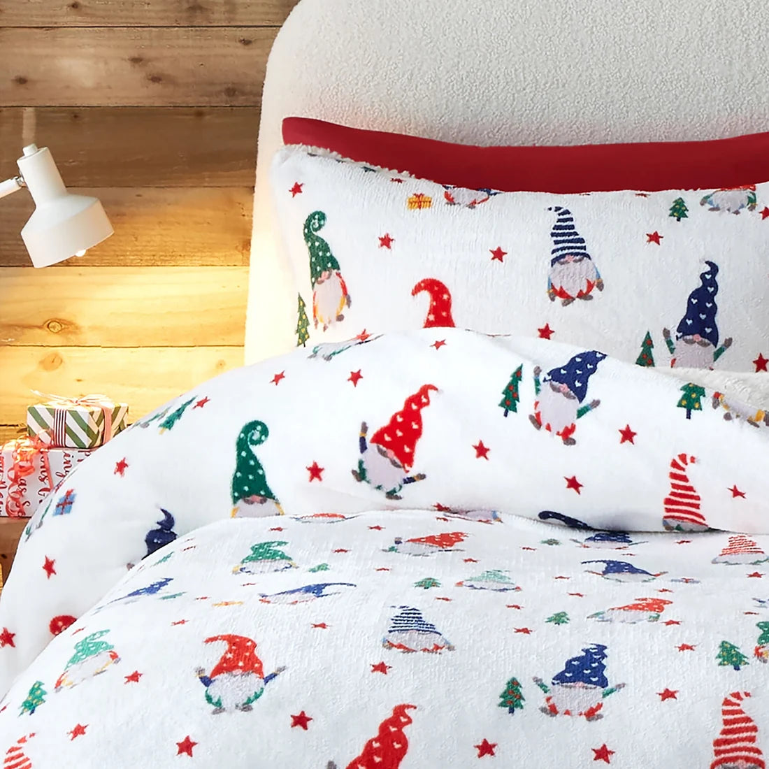 Close-up of the festive gonk, Christmas tree and present design on the Fusion Festive Gonks duvet cover set.