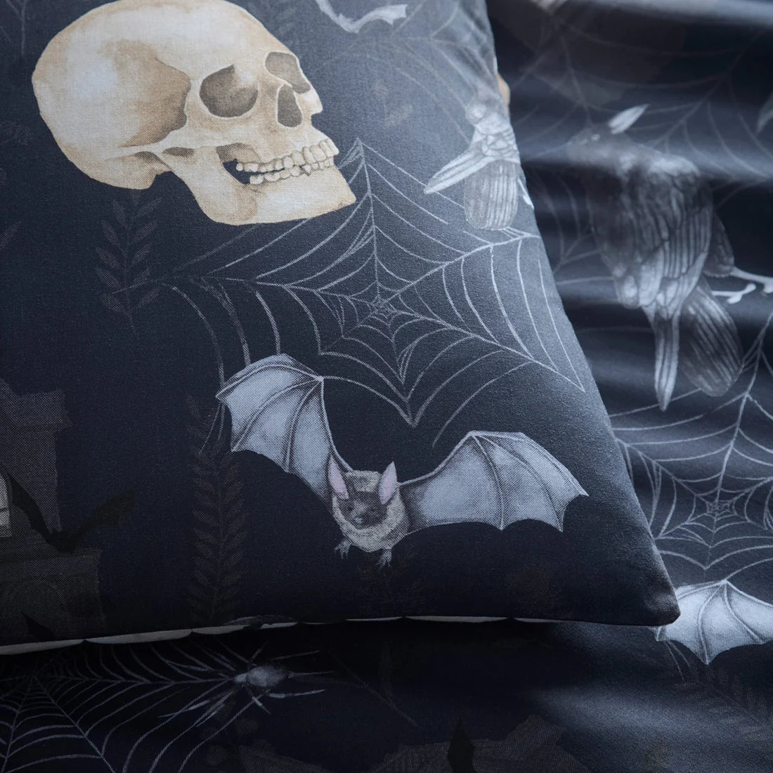 Close-up of the soft cotton-rich polycotton fabric on the Fusion Gothic Skulls Halloween duvet cover set.