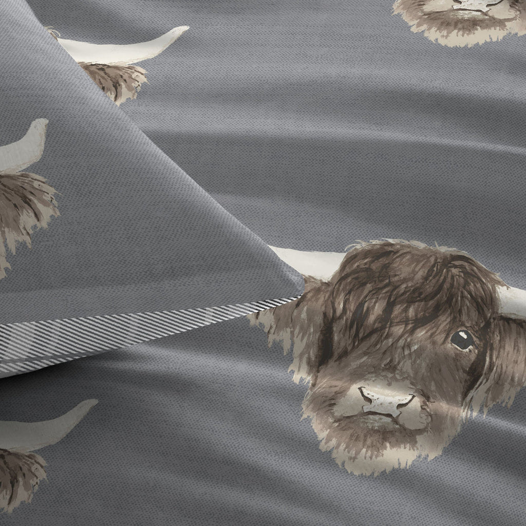 Close-up of the soft cotton-rich polycotton fabric on the Fusion Highland Cow grey duvet cover set.