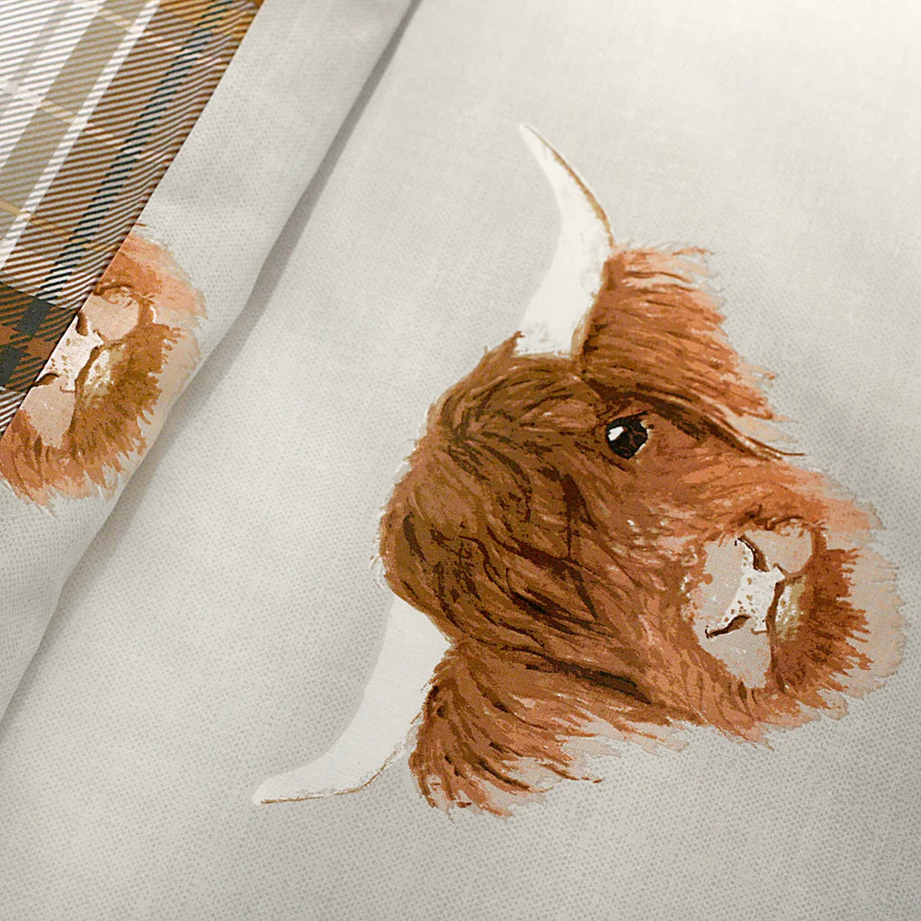 Close-up of the soft cotton-rich polycotton fabric on the Fusion Highland Cow duvet cover set.

