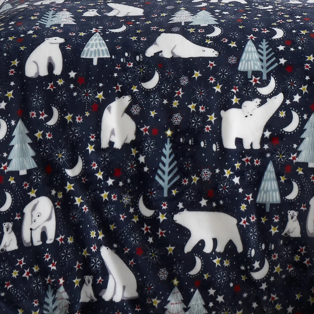 Close-up of the polar bear winter scene on the Fusion Starry Night Christmas throw.