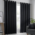 Fusion Strata dim-out eyelet curtains in black.