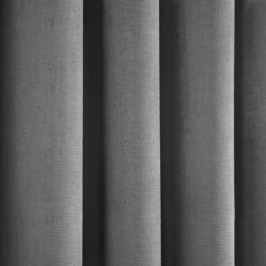 Close-up of the semi-plain textured fabric on the Fusion Strata eyelet curtains.