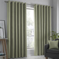 Fusion Strata dim-out eyelet curtains in green.