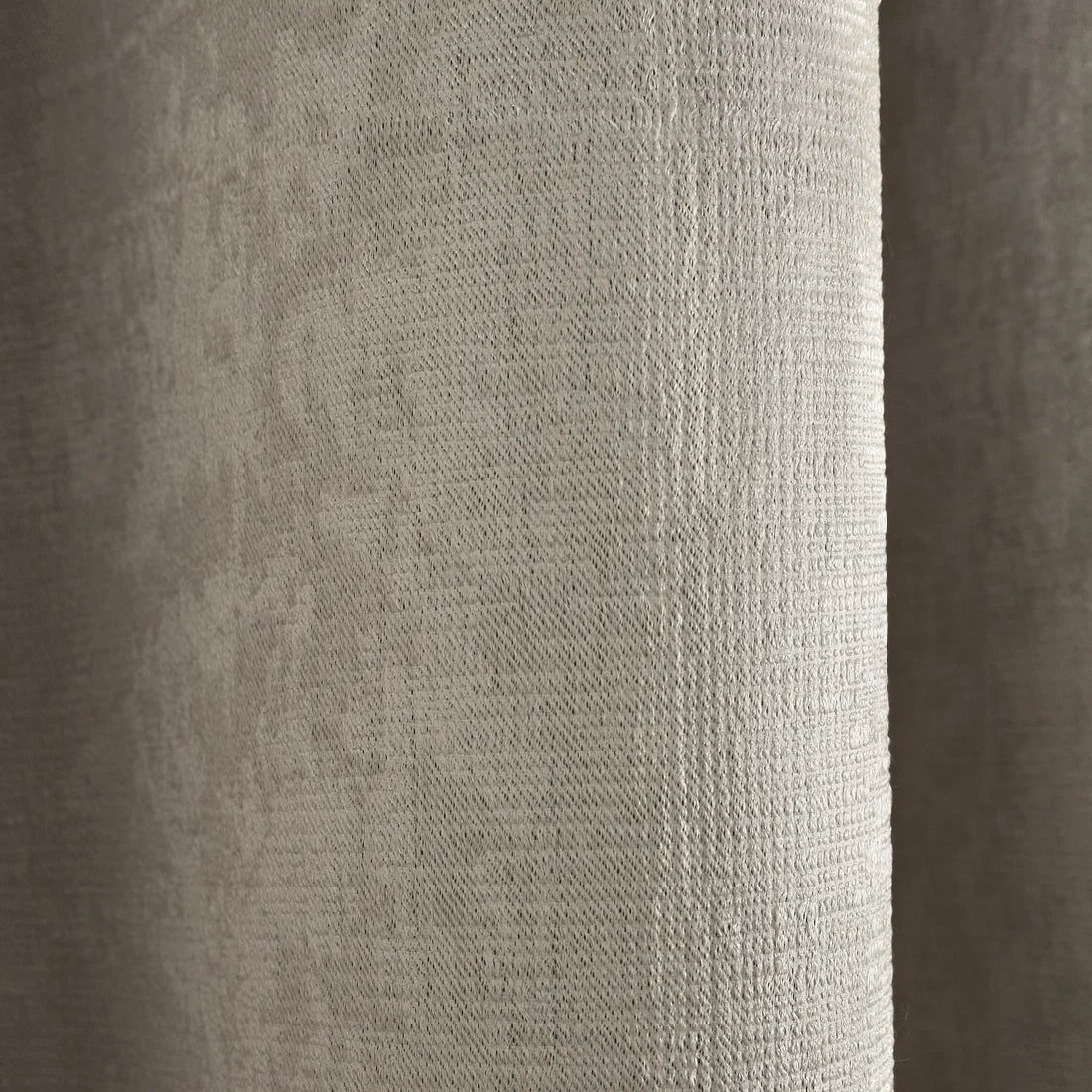 Close-up of the semi-plain textured fabric on the Fusion Strata eyelet curtains.