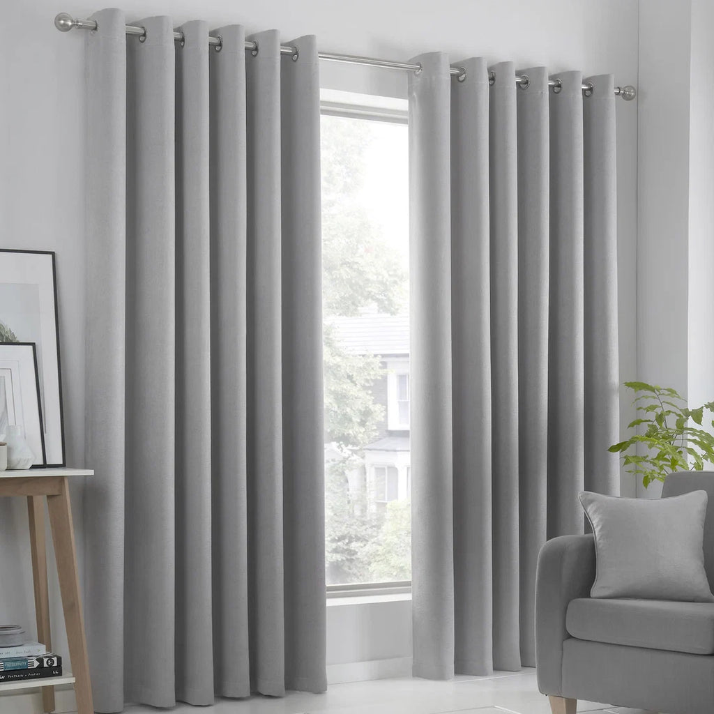 Fusion Strata dim-out eyelet curtains in silver.