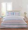 Horizon watercolour stripe duvet cover set styled in a modern bedroom.