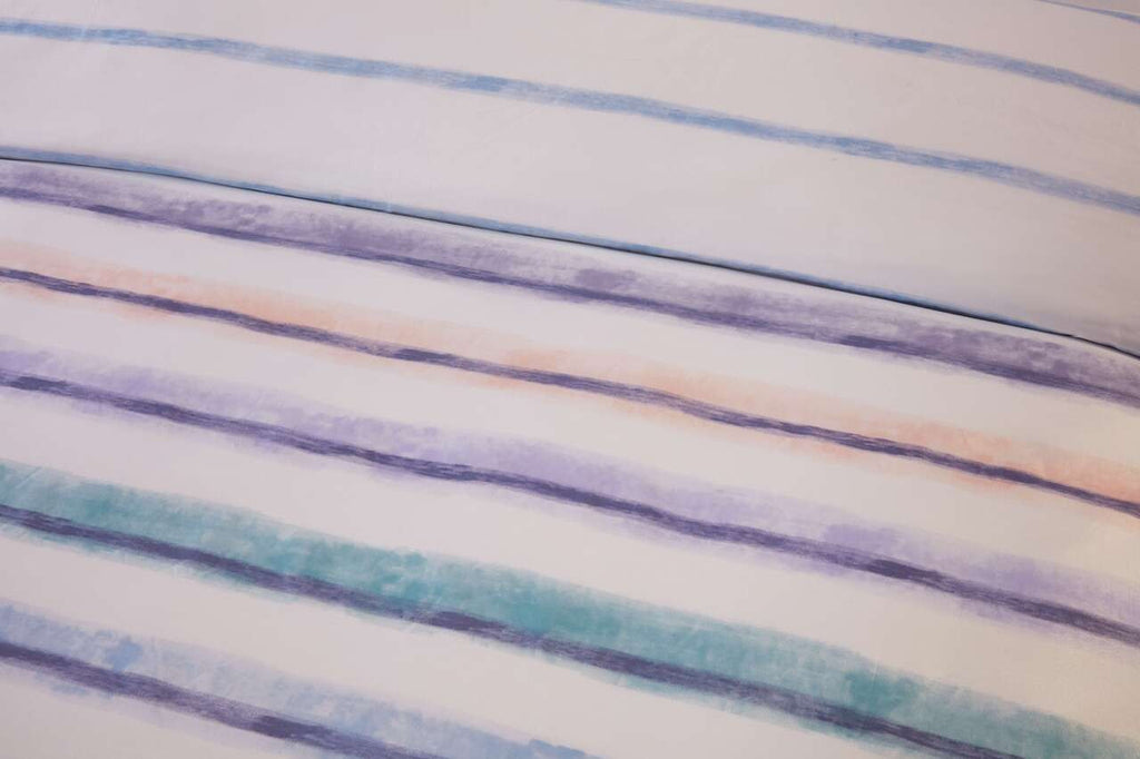 Close-up of the watercolour stripe pattern on the Horizon duvet cover set.