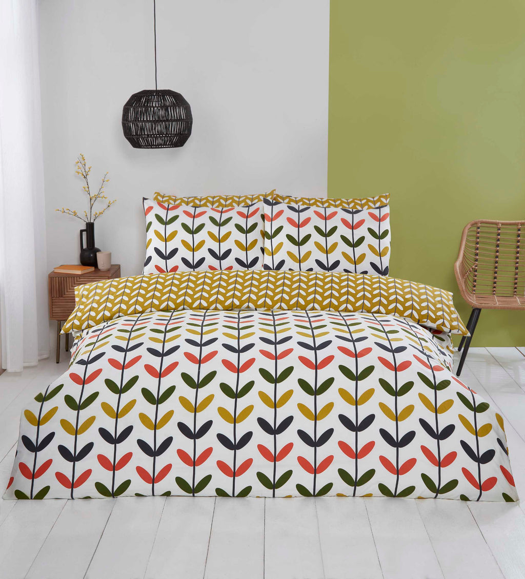 Jules multi-coloured duvet cover set styled in a modern bedroom.