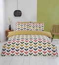 Jules multi-coloured duvet cover set styled in a modern bedroom.