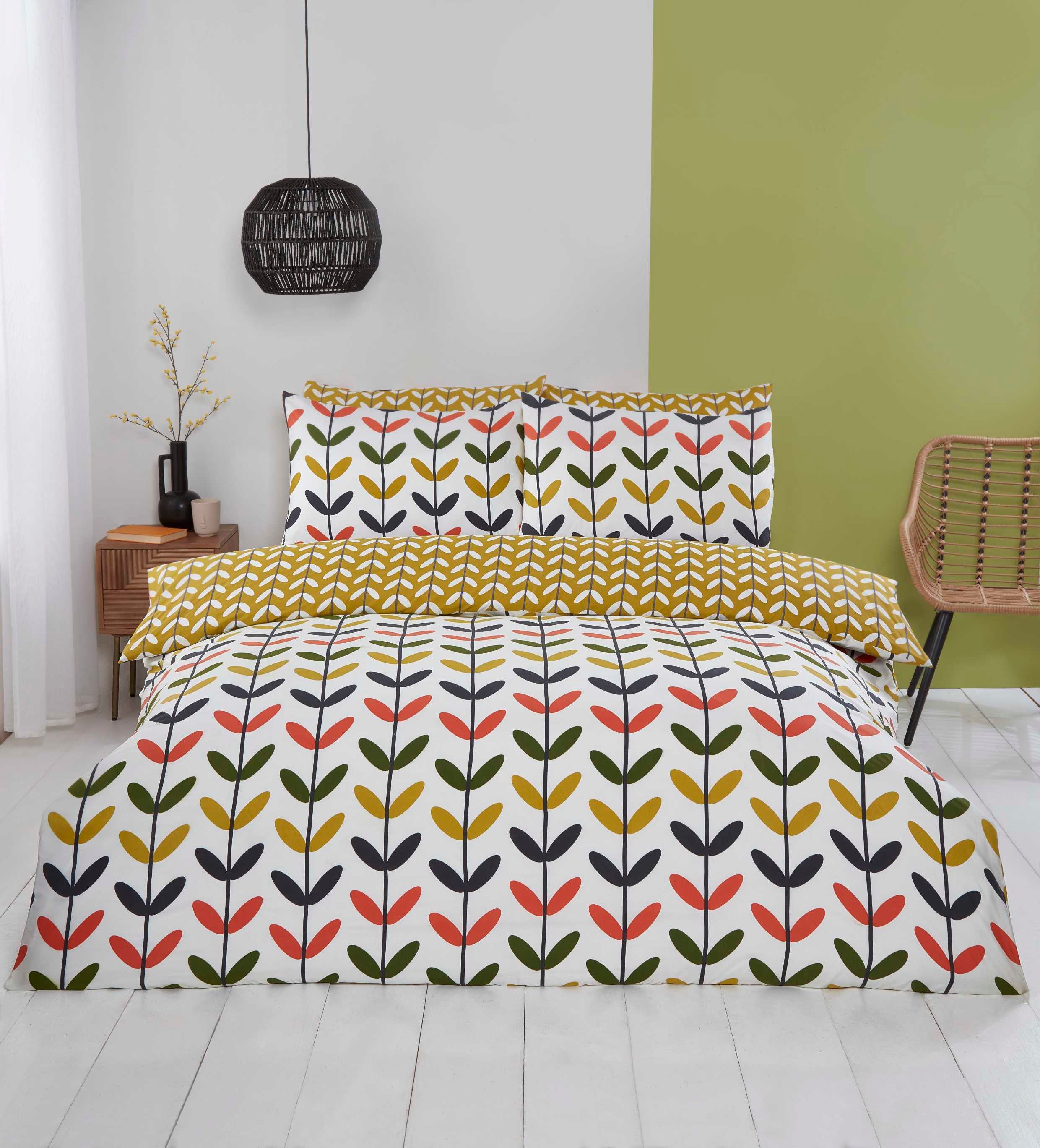 Jules multi-coloured duvet cover set styled in a modern bedroom.