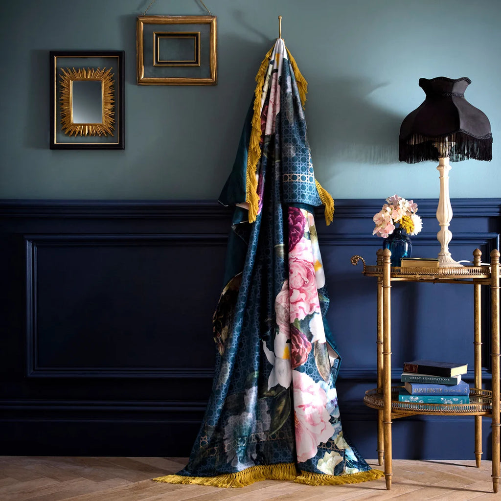 Laurence Llewelyn-Bowen Bouquet List blue velvet throw with vibrant floral design.
