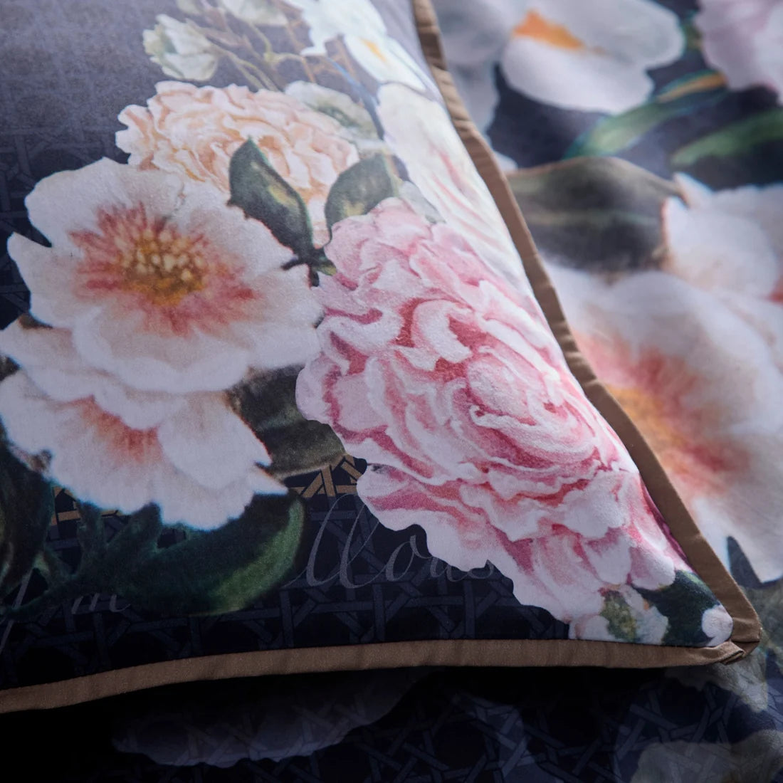 Close-up of the smooth 100% cotton sateen fabric and flat piped edging on the Bouquet List duvet cover set.