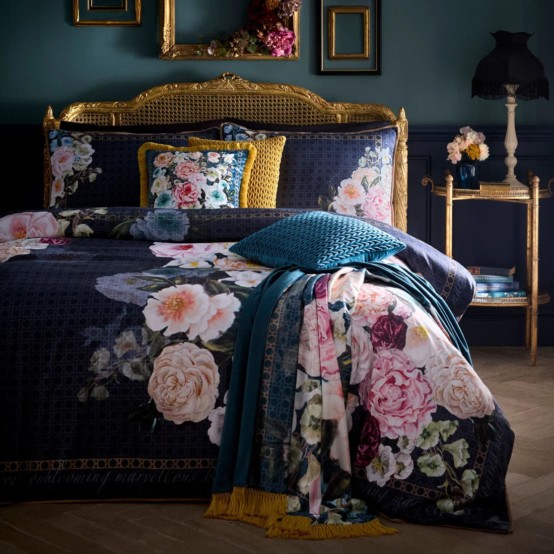 Laurence Llewelyn-Bowen Bouquet List velvet cushion in blue 43 x 43cm pictured with matching throw and bedding