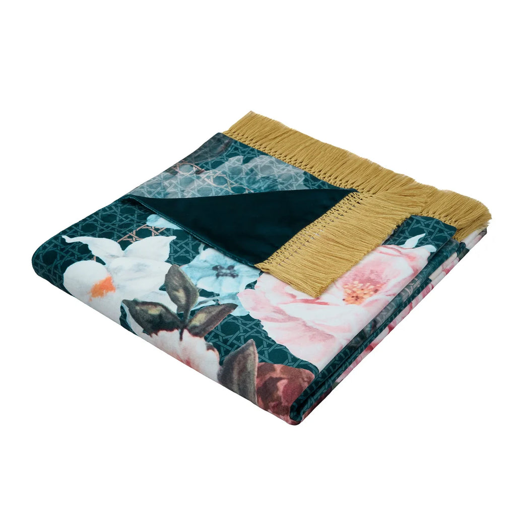 Close-up of the floral trellis pattern, soft velvet fabric and tasselled edging on the Bouquet List throw.