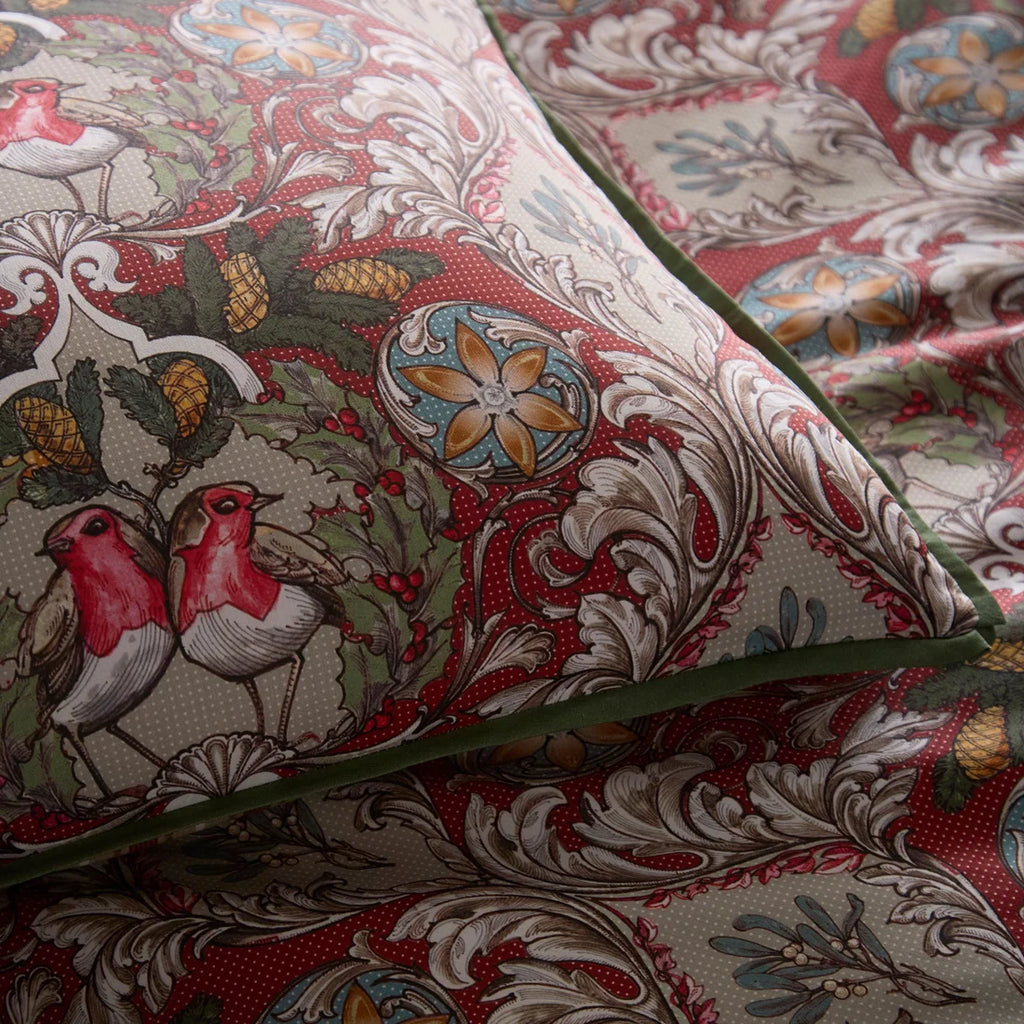 Close-up of the smooth 100% cotton sateen fabric and flat piped edging on the Festive Robin duvet cover set.