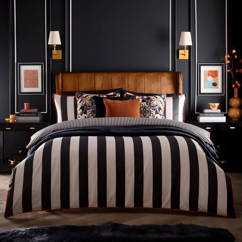 Laurence Llewelyn-Bowen Festivo Circus Stripe Black duvet cover set styled in a luxurious bedroom.