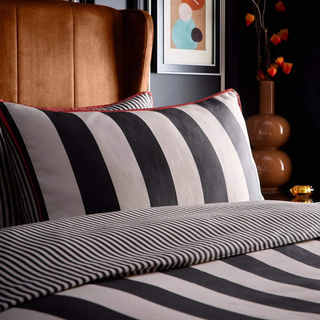 Close-up of the black and natural striped design on the Laurence Llewelyn-Bowen Festivo Circus Stripe bedding.