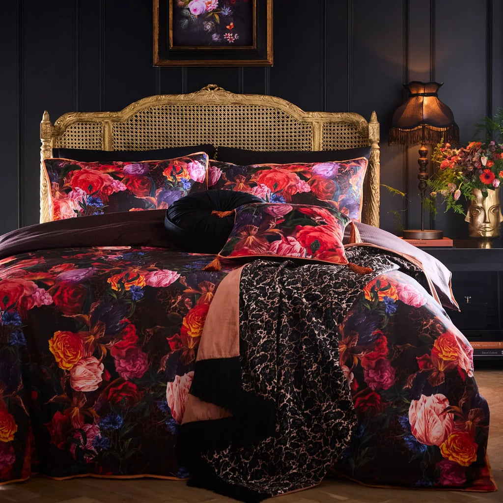 Laurence Llewelyn-Bowen Grande Chintz velvet cushion styled in a luxurious maximalist interior with matching bedding