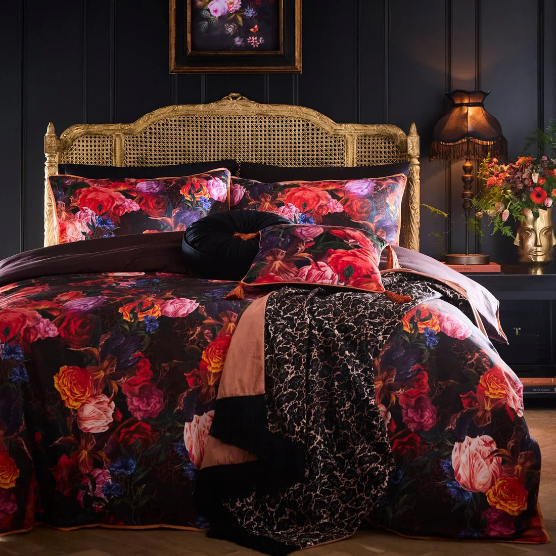 Laurence Llewelyn-Bowen Grande Chintz velvet cushion styled in a luxurious maximalist interior with matching bedding