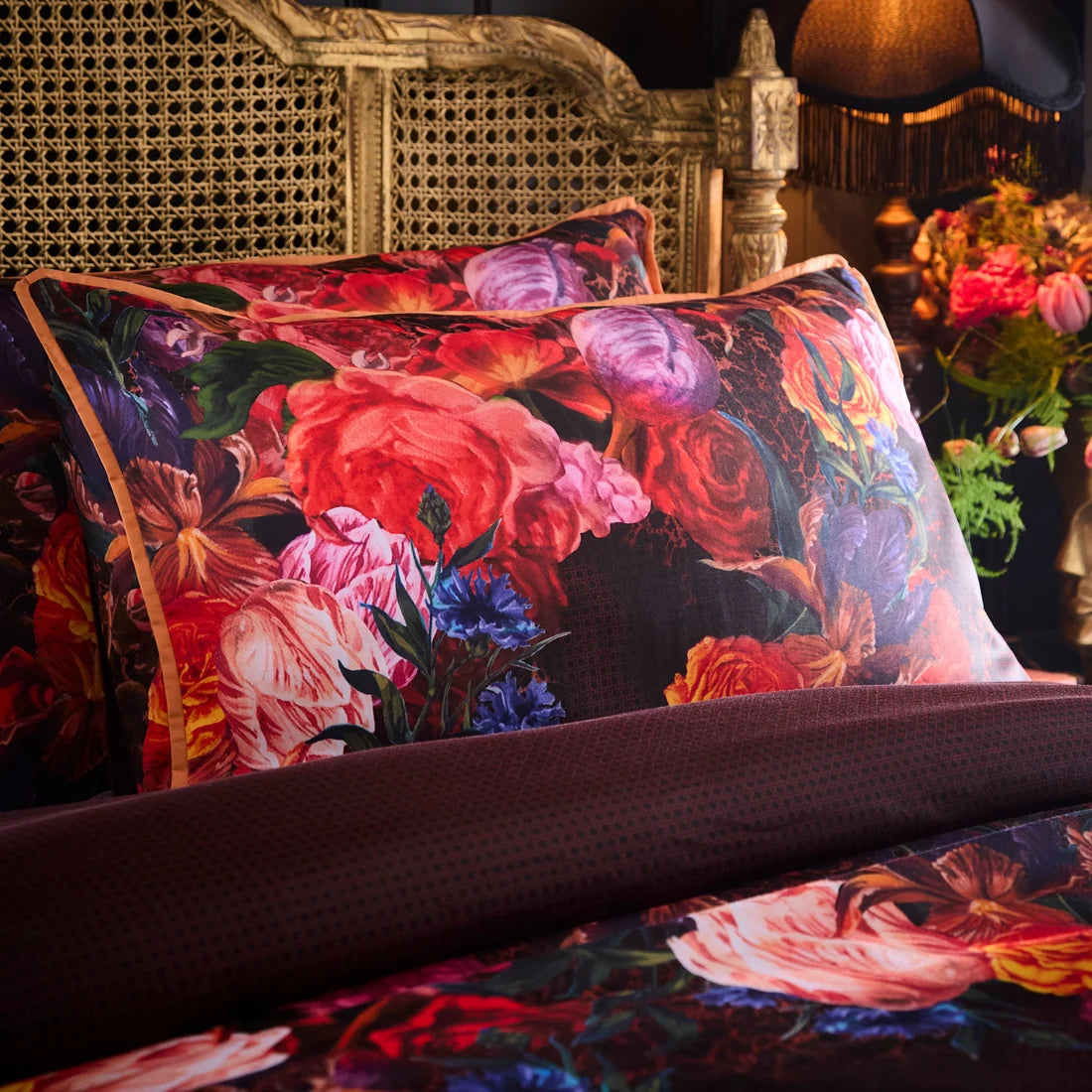 Close-up of the bold floral and subtle leopard print design on the Laurence Llewelyn-Bowen Grande Chintz duvet cover set.