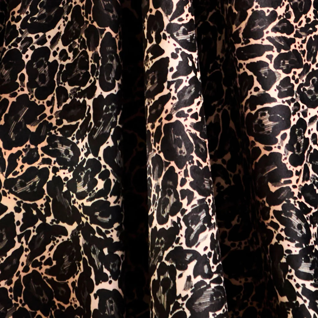 Close-up of the soft velvet fabric and black fringed edging on the Josephine throw.