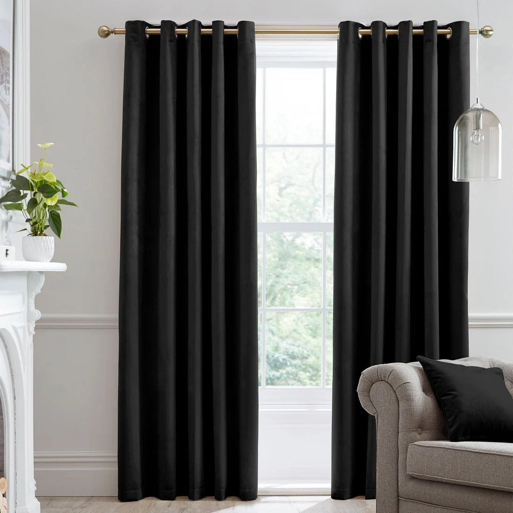 Laurence Llewelyn-Bowen Montrose blackout velvet eyelet curtains in black.