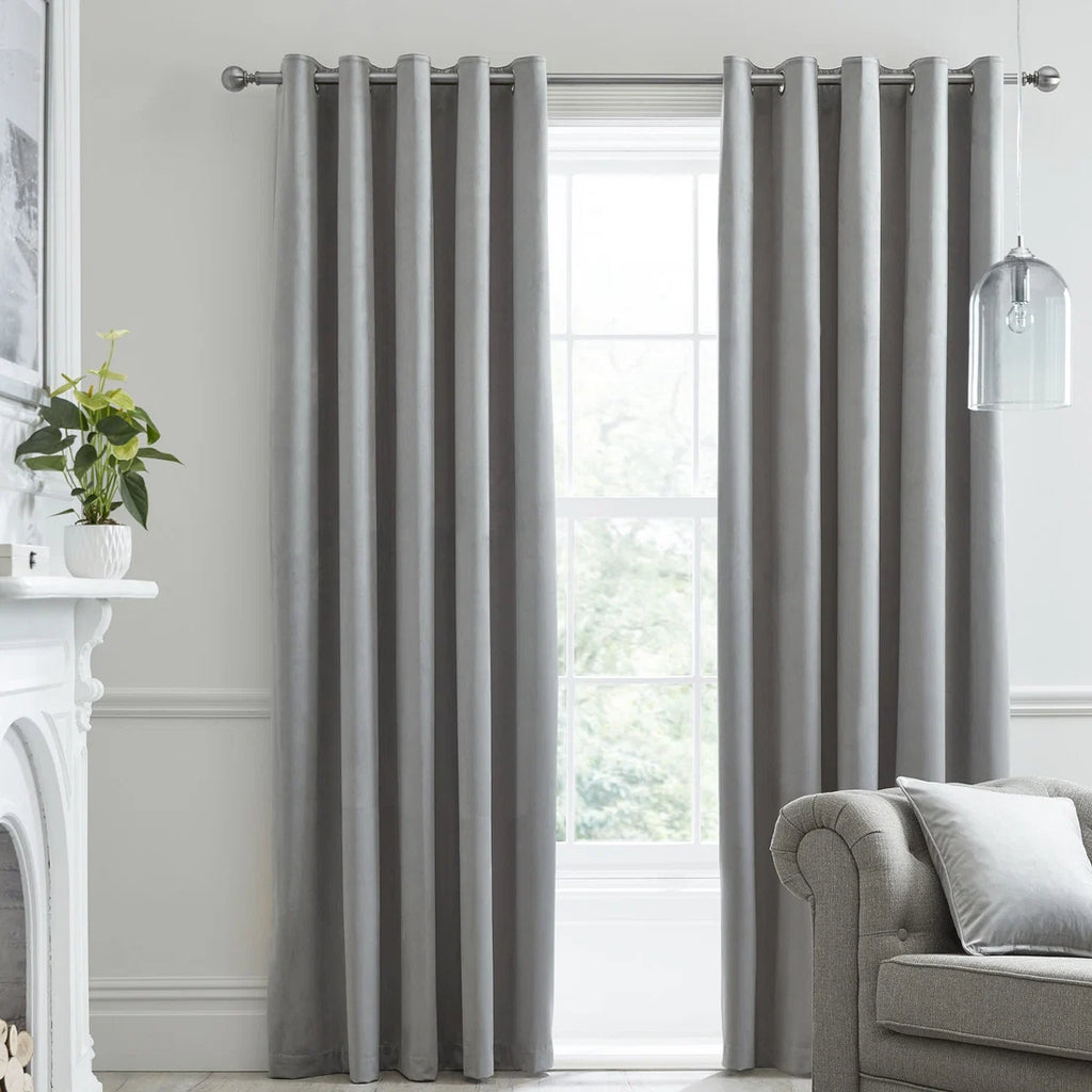Laurence Llewelyn-Bowen Montrose blackout velvet eyelet curtains in silver.