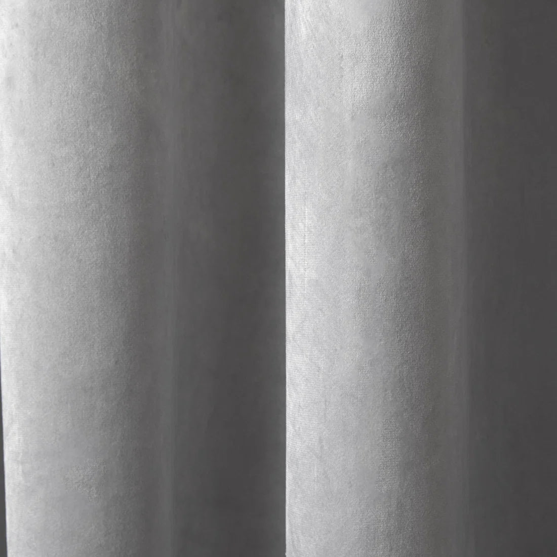Close-up of the soft silver velvet fabric on the Laurence Llewelyn-Bowen Montrose curtains.