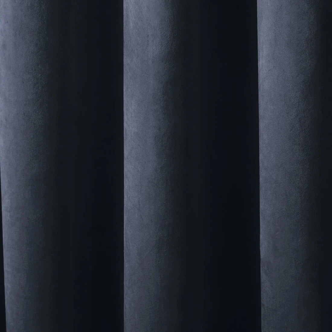 Close-up of the soft navy velvet fabric on the Laurence Llewelyn-Bowen Montrose curtains.