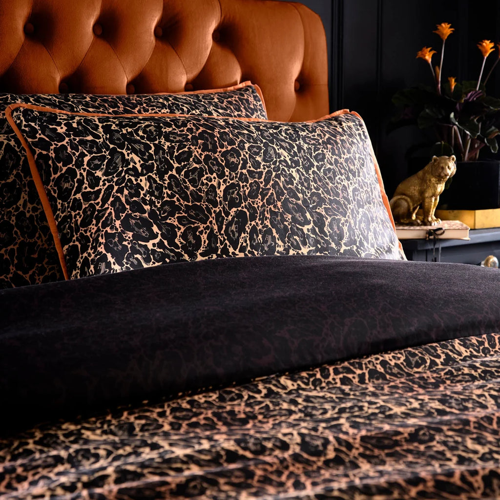Close-up of the bold leopard print on the Laurence Llewelyn-Bowen Roxy Leopard duvet cover set.