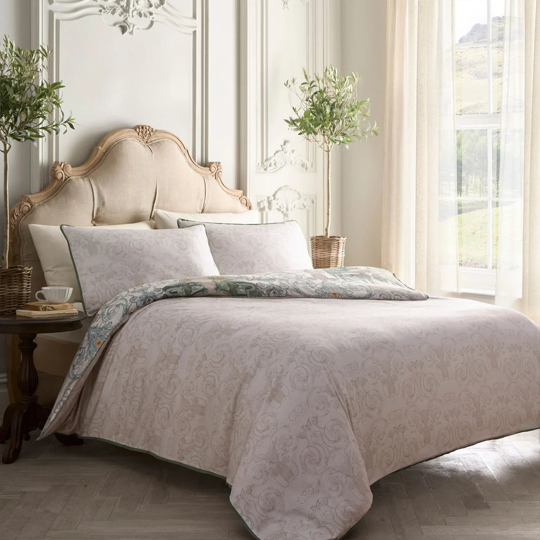 Close-up of the geometric and scrolling design on the Laurence Llewelyn-Bowen Tuscan Garden duvet cover set.