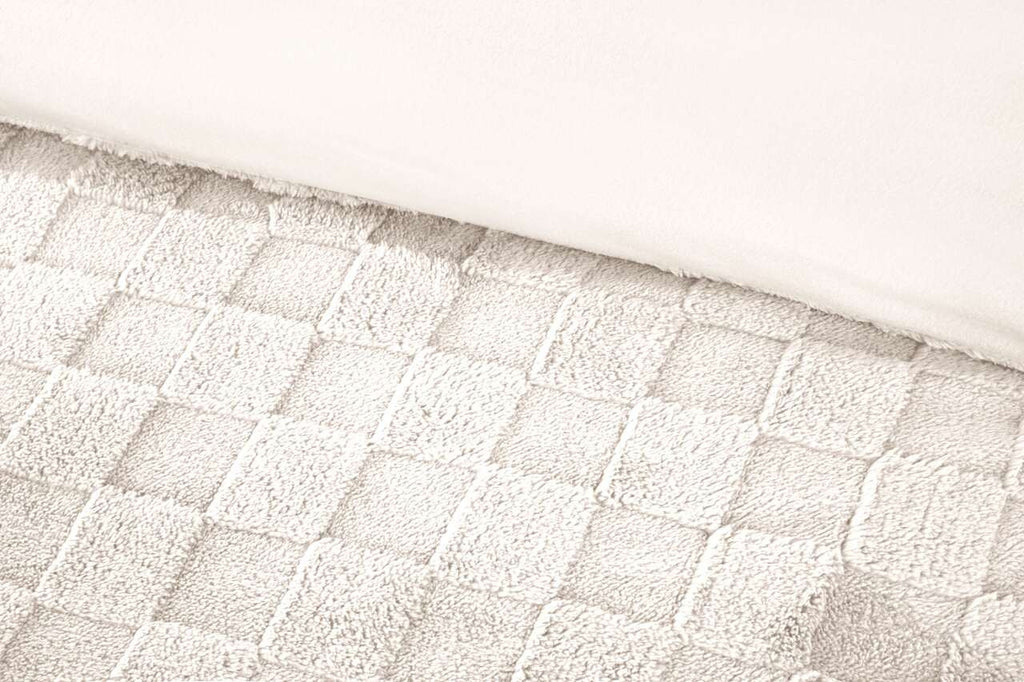 Close-up of the raised checkerboard texture on the Luxury Check Teddy duvet cover set in Cream.