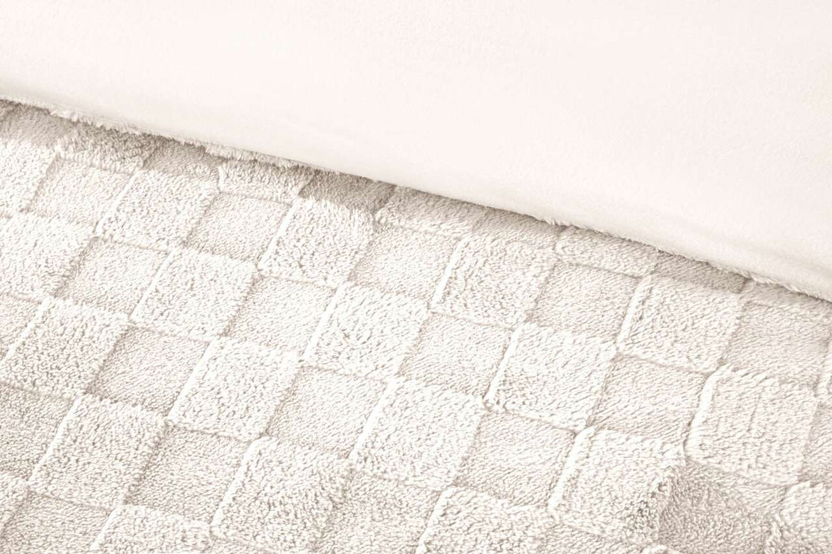 Close-up of the raised checkerboard texture on the Luxury Check Teddy duvet cover set in Cream.