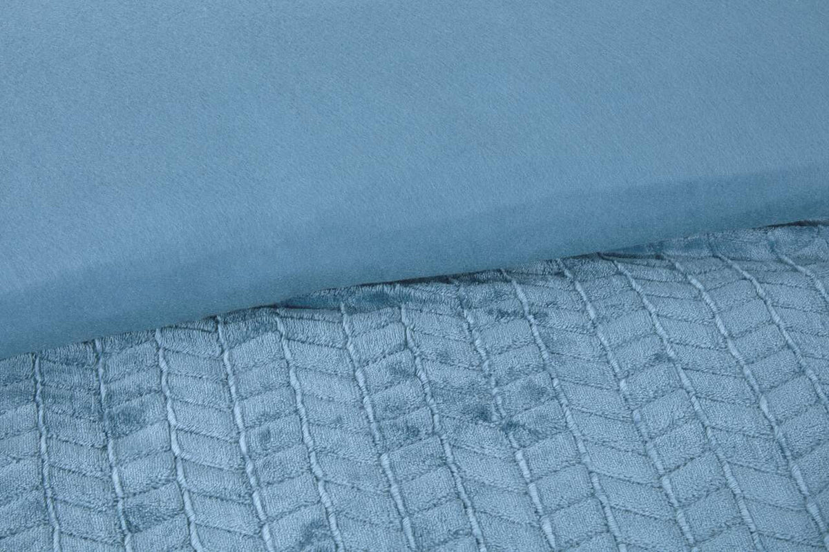 Close-up of the sculpted chevron texture on the Luxury Faux Fur duvet cover set in Steel Blue.