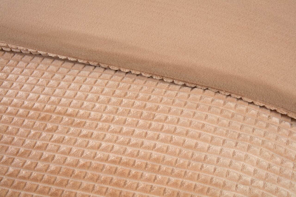 Close-up of the waffle textured teddy fleece on the Luxury Waffle duvet cover set in Latte.