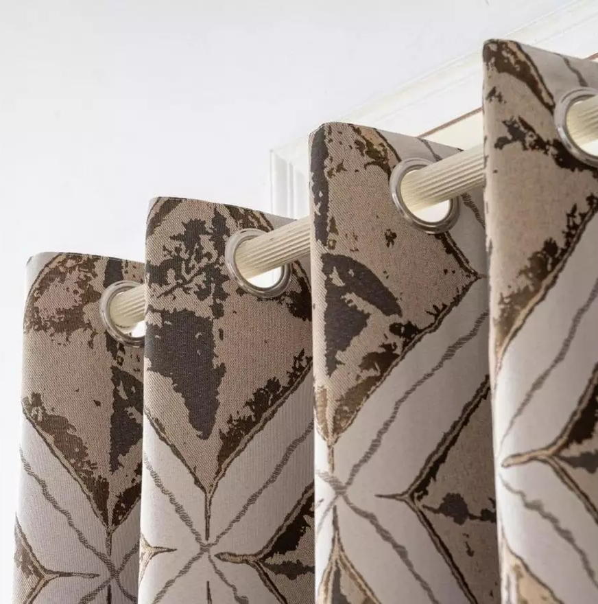 Eyelet heading detail on the Matrix Cream and Gold lined curtains.