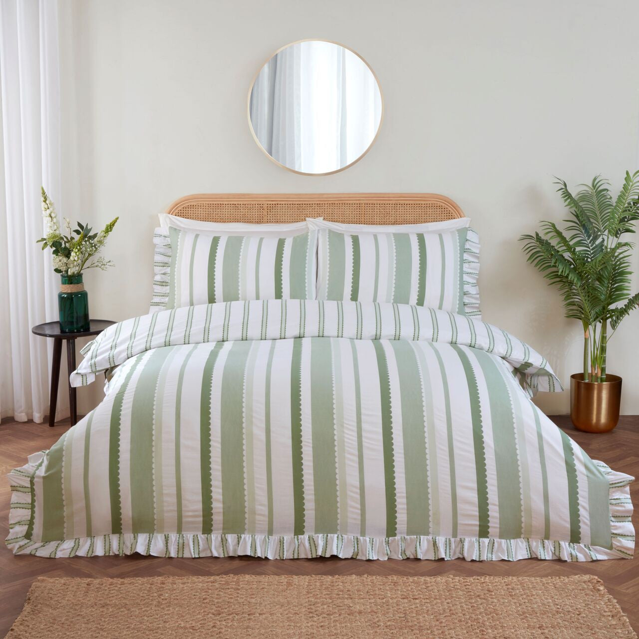 Maya Frilled green duvet cover set styled in a bright and elegant bedroom.