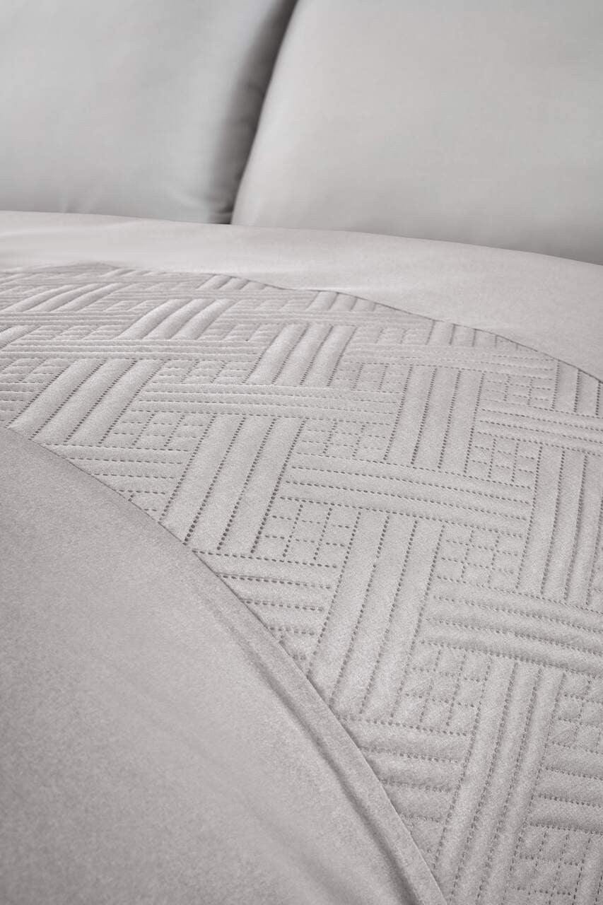 Close-up of the geometric pinsonic panel detailing on the Nova duvet cover set.