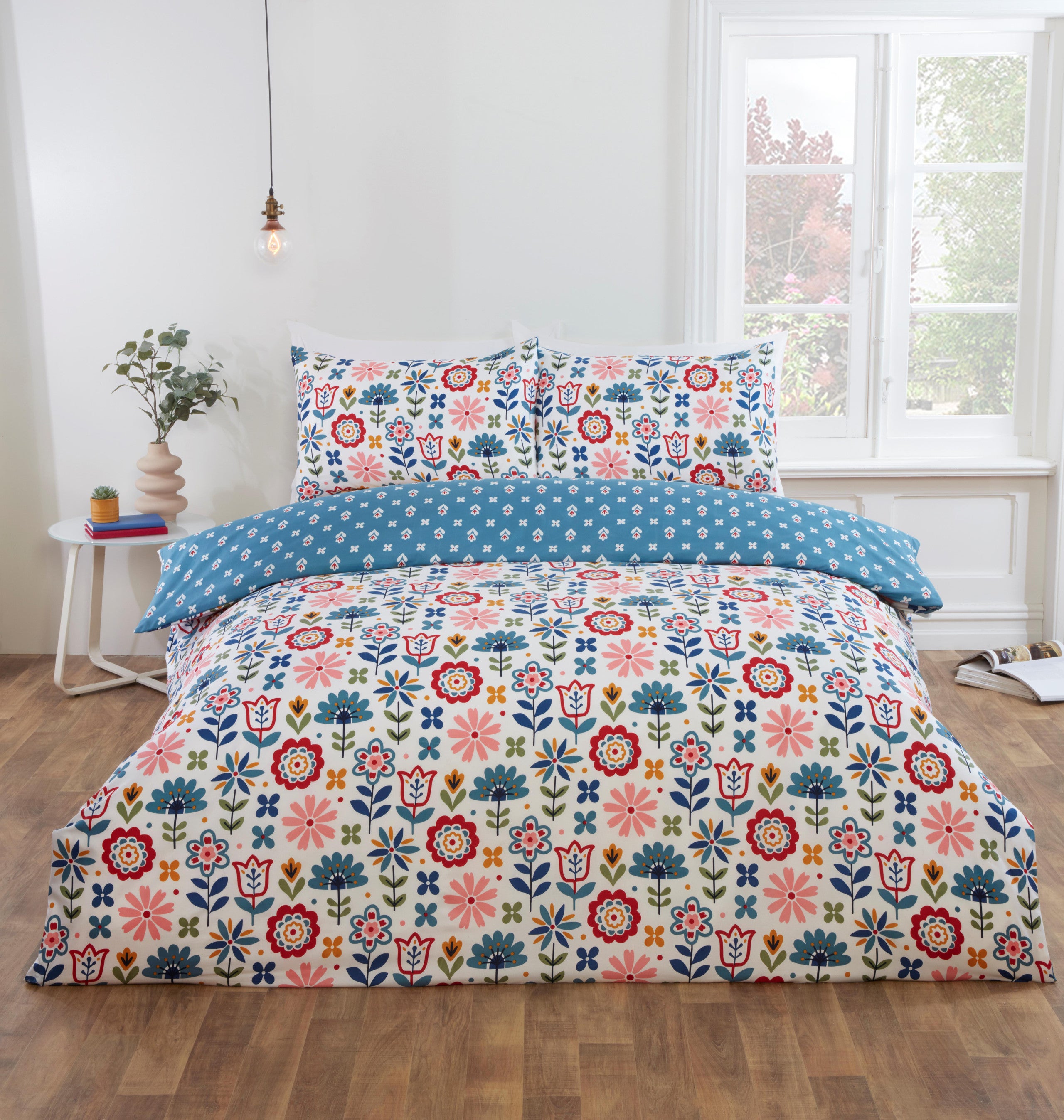 Olivia reversible floral microfibre duvet cover set with colourful folk-inspired flowers.