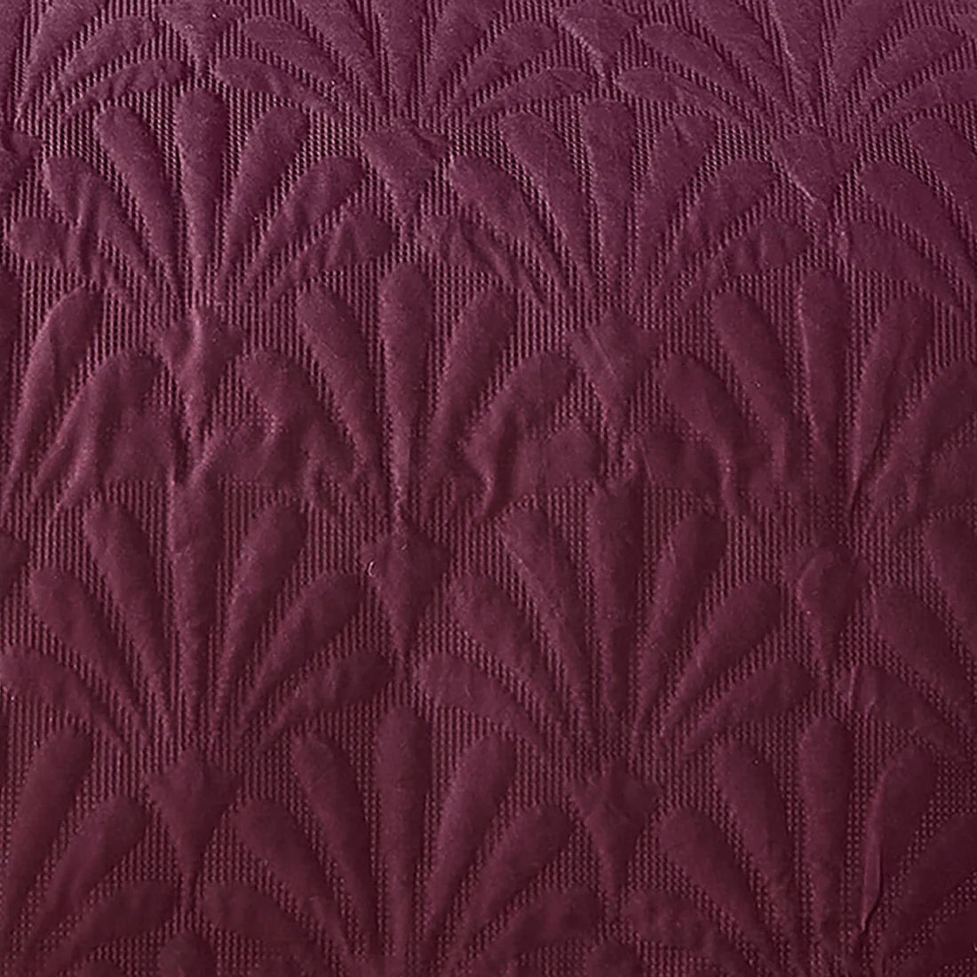 Close-up of the Pinsonic textured quilted pattern on the Serene Cavali bedspread.
