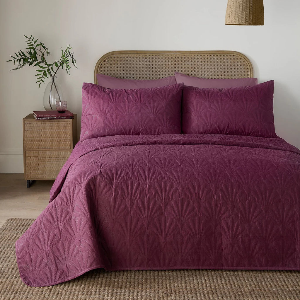 Serene Cavali textured quilted bedspread in berry measuring 200 x 230cm.