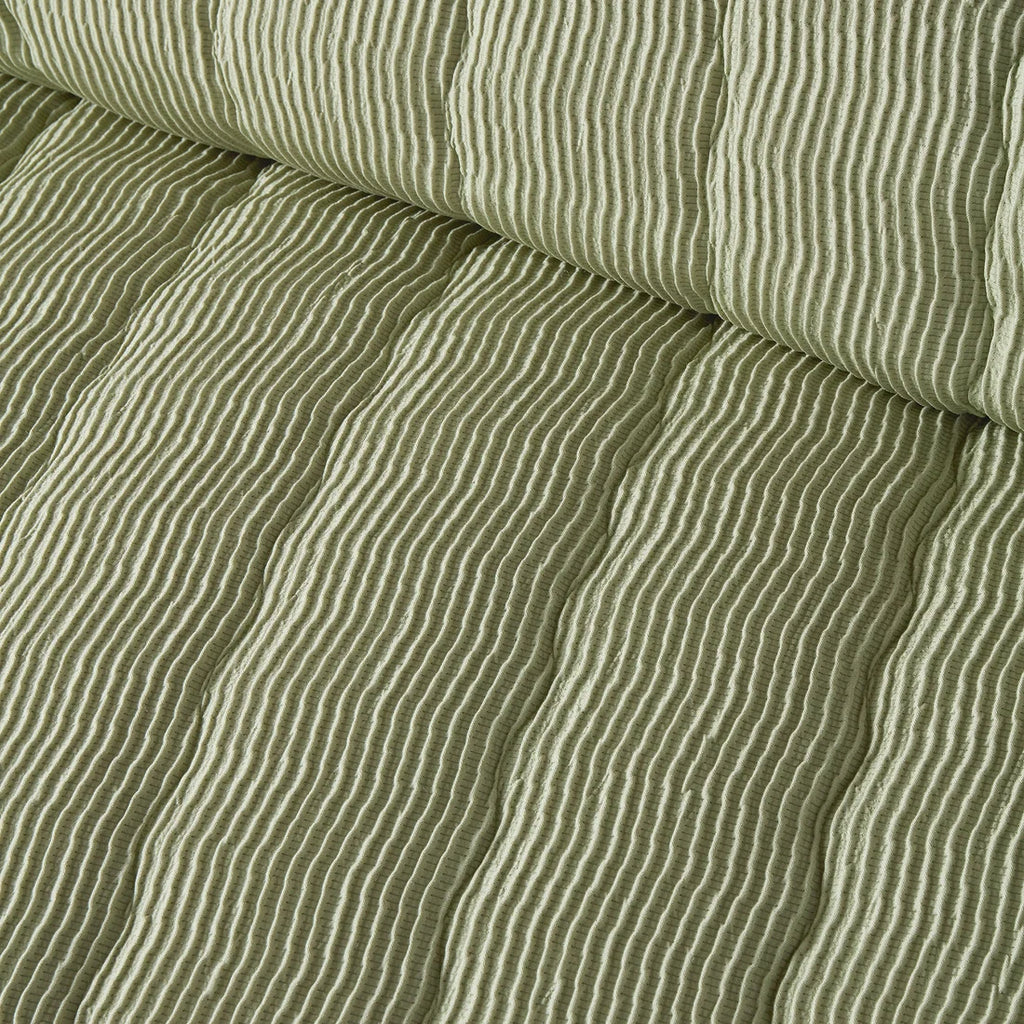 Close-up of the soft polyester fabric on the Serene Crinkle Wave duvet cover set.