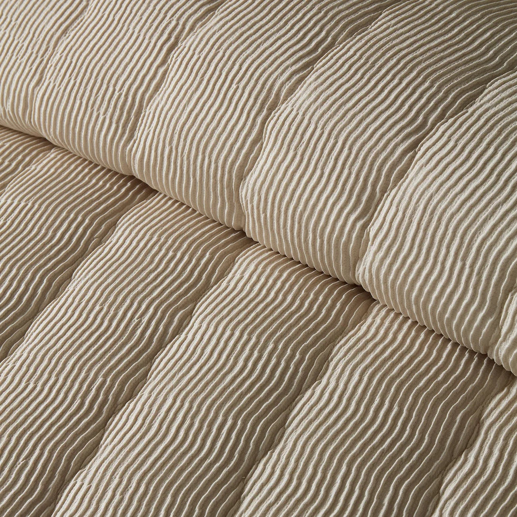 Close-up of the soft polyester fabric on the Serene Crinkle Wave duvet cover set.