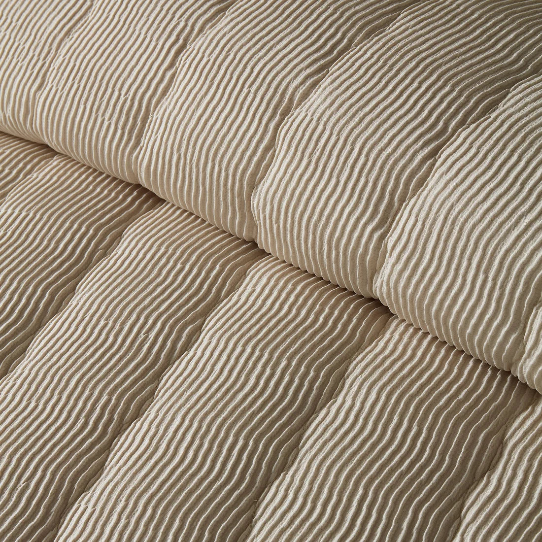 Close-up of the soft polyester fabric on the Serene Crinkle Wave duvet cover set.