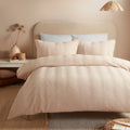 Serene Embossed Curve textured duvet cover set in natural with an embossed wave design.
