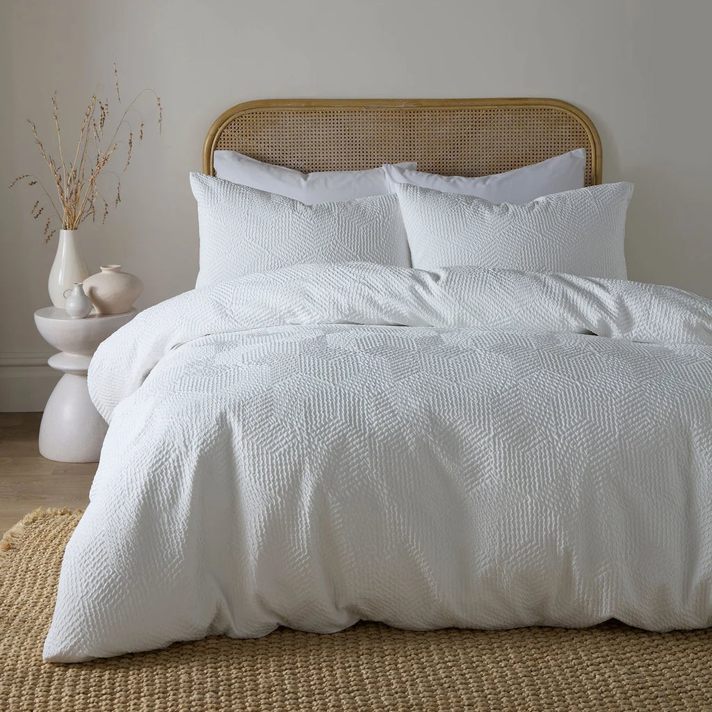 Serene Embossed Geo textured duvet cover set in white with an embossed geometric pattern.
