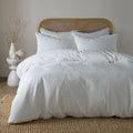 Serene Embossed Geo textured duvet cover set in white with an embossed geometric pattern.